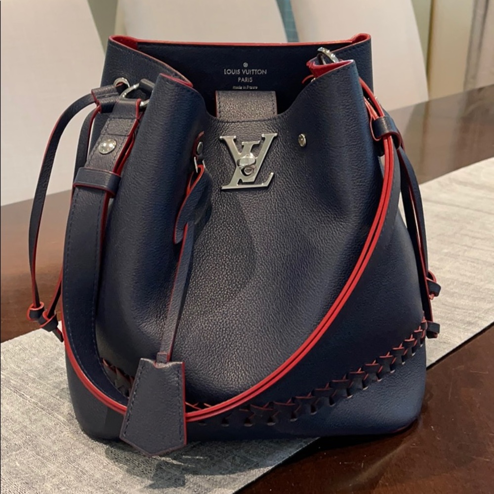 SOLD!!!! Louis Vuitton Lock me bucket bag 100% authentic.